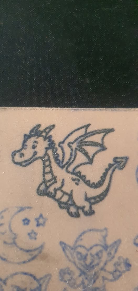 Mini dragon tattoo detail